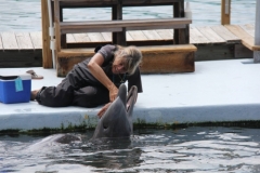 Linda and dolphin laughing together
