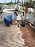 Tom oiling teak on aft deck